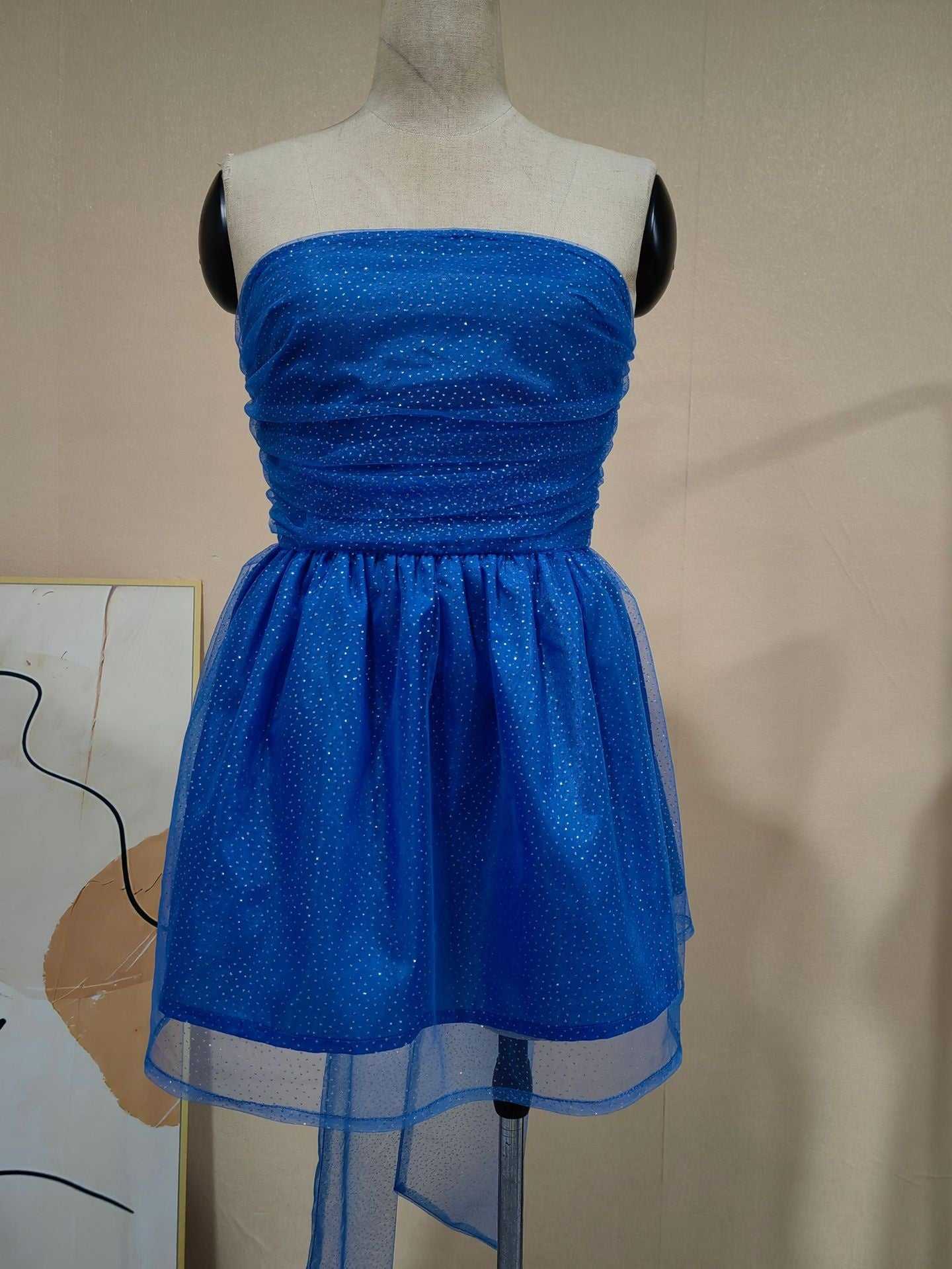 Blue tube top lace dress with mesh stitching and short skirt on mannequin