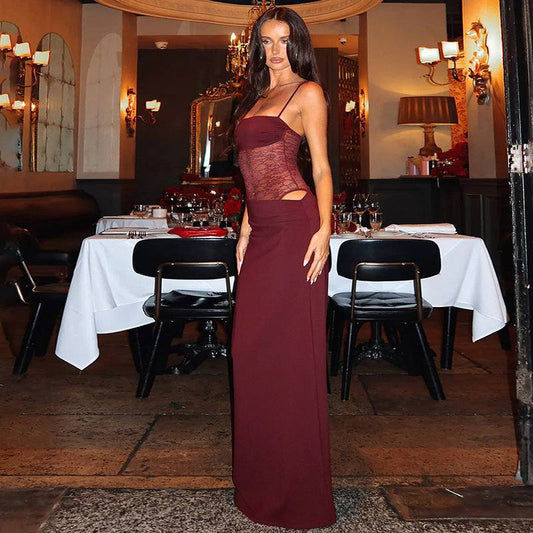 Woman wearing burgundy Y2K lace suspender dress with cut-out lace sides at elegant restaurant party