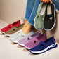 Colorful women's mesh flats shoes with breathable, non-slip soft bottoms displayed on feet and held in hand casual style
