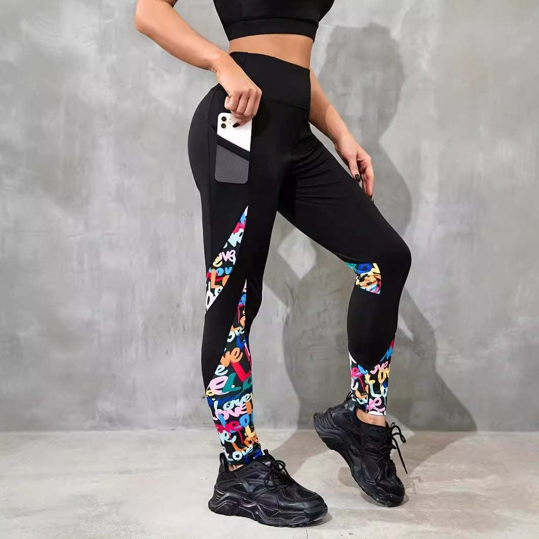 Women wearing black high waist sports leggings with colorful contrast patchwork and side pocket holding phone