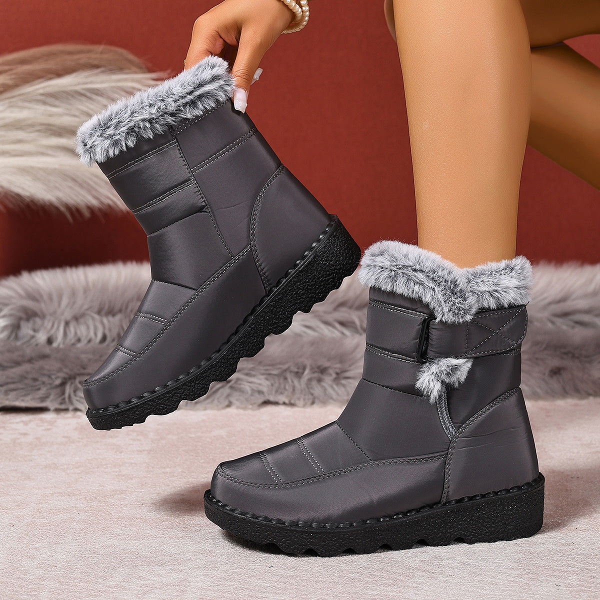 Plus size women's black snow boots with warm faux fur lining and flat polyurethane sole