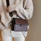 Wide shoulder strap small square PU leather messenger bag in dark brown with soft handle and car stitch detail