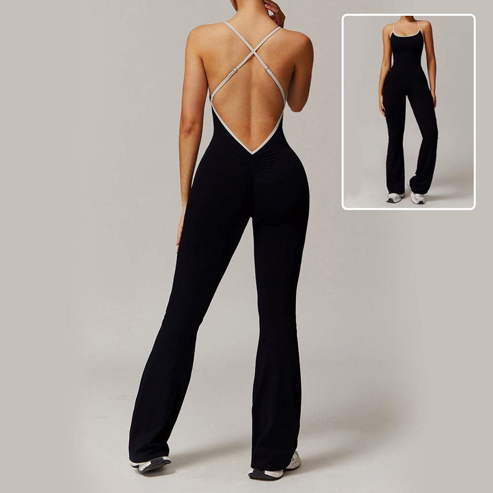 Woman wearing black Solid Beauty-back slim fit jumpsuit with crisscross open back, designed for yoga, fitness, and running.