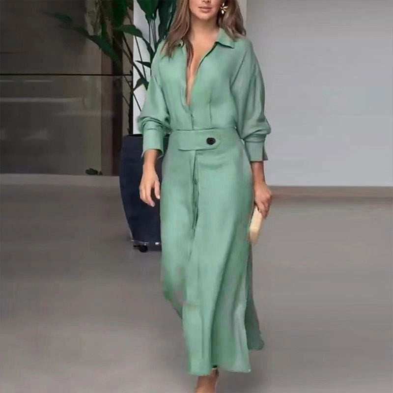 Woman wearing elegant tied solid color waisted long-sleeved green shirt dress walking indoors