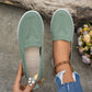 Light green women's summer mesh casual shoes with flat low heels and round toes, styled with ripped jeans and ankle bracelet outdoors