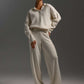 Woman wearing cream-colored fall winter two piece collar sweater set with loose fit and long sleeves
