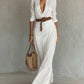 Elegant white irregular long dress with belt and button lapel, long sleeves, perfect for office and daily wear