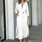 Women's elegant white tied waist long-sleeved shirt dress with asymmetric skirt and pockets