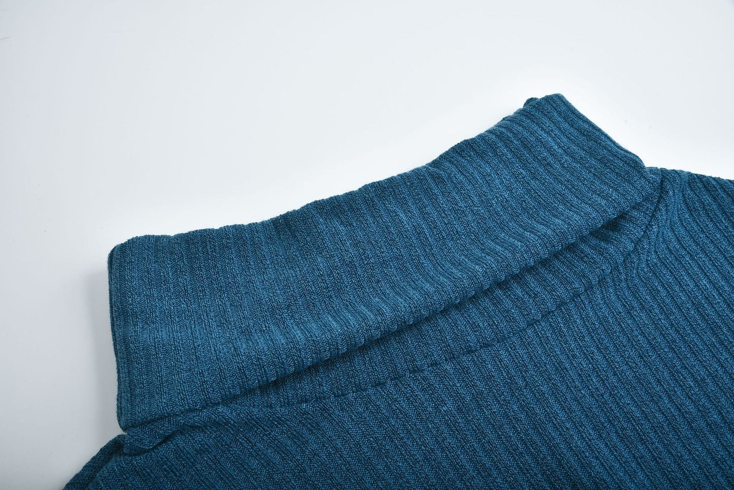 Women's lapel pullover knit sweater in blue cotton blend fabric with ribbed texture and folded collar