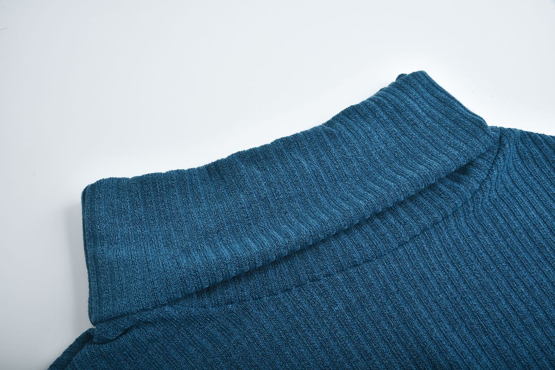Women's lapel pullover knit sweater in blue cotton blend fabric with ribbed texture and folded collar