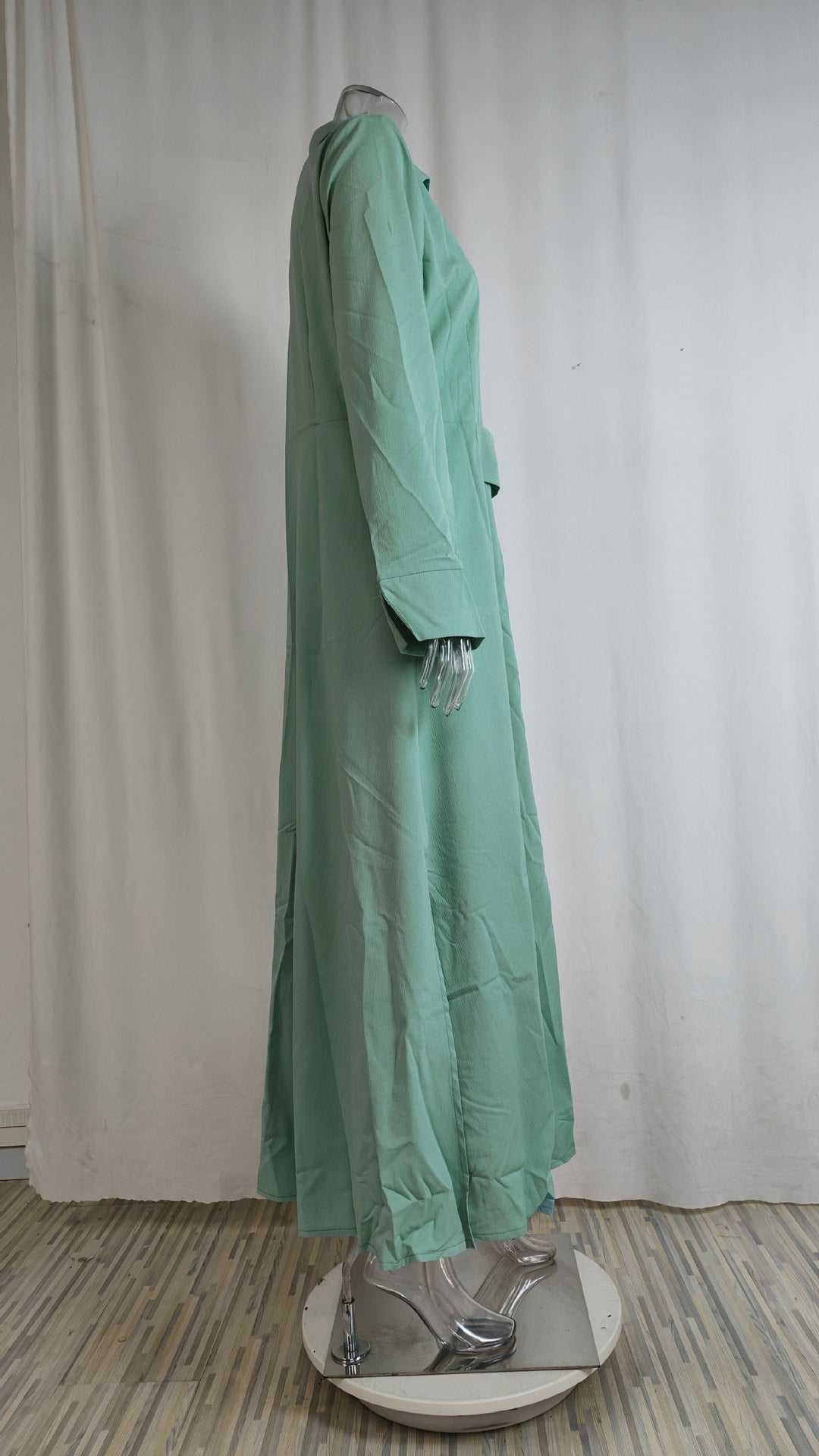 Women's elegant tied solid color waisted long-sleeved shirt dress in light green polyester with asymmetric skirt and pockets