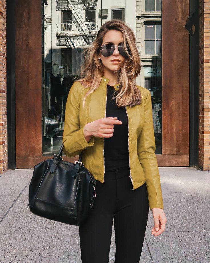 Woman wearing yellow PU leather jacket with zipper and black handbag outdoors, urban casual style women jacket