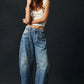 Women wearing high stretch mid-rise wide leg denim jeans with casual tank top