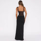 Back view of woman wearing black Y2K lace suspender long dress with sleeveless high waist design