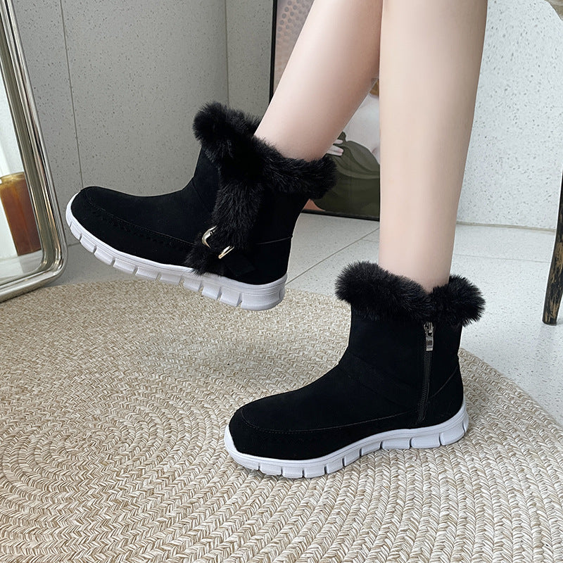 Black winter snow boots with plush ankle fur, buckle design, side zipper, and white rubber flat soles for women