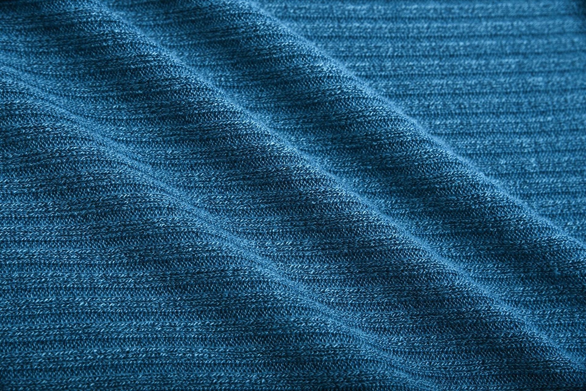 Close-up of blue cotton blend knit fabric for women's lapel pullover sweater