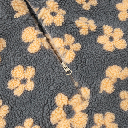 Close-up of winter flowers lambskin sweatshirt with yellow flower pattern and zipper detail