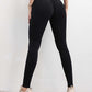 Woman wearing black seamless high waist yoga pants with scrunch butt design and elastic fit for workout and casual wear