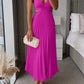 Woman wearing pink Ins suspender pleated long dress with hollow-waisted design and V-neck backless style indoors