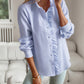 Women's striped long sleeve ruffle button-up shirt in light blue for casual office wear