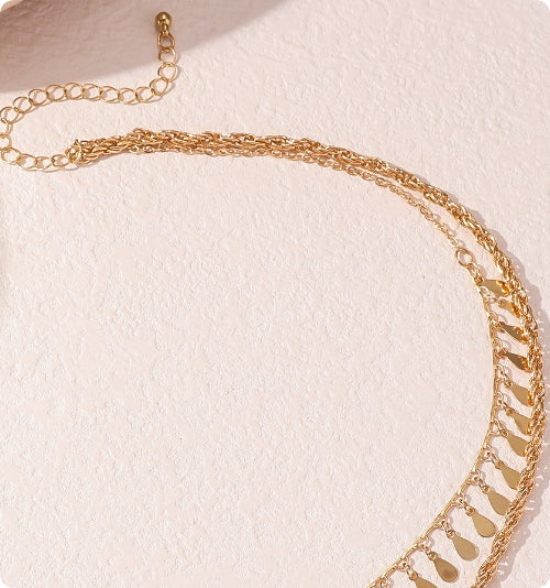 Gold multi-layer braided chain necklace with droplet-shaped tassel pendant for women