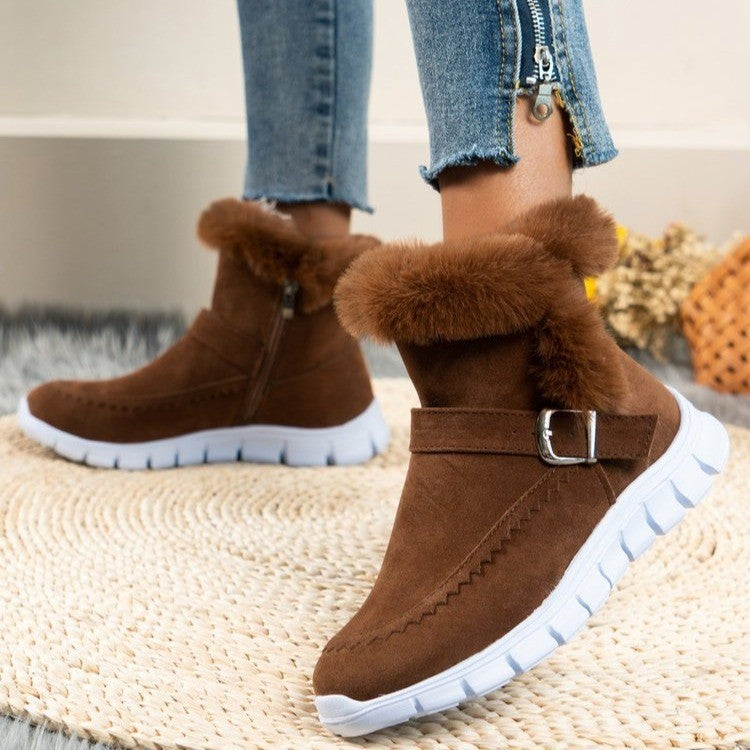 Brown suede snow boots winter with plush ankle, buckle design, white rubber sole, and side zipper closure for women