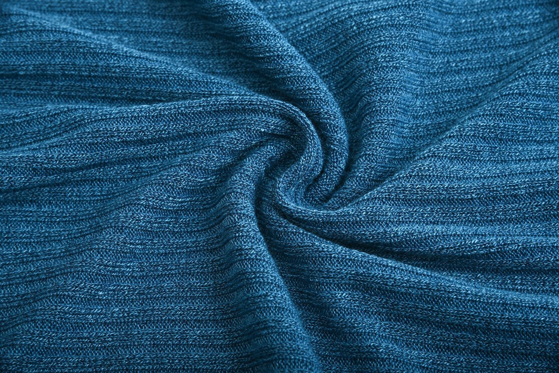 Close-up of blue cotton blend knit fabric for women's lapel pullover sweater
