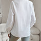 Woman wearing white ruffle collar striped long sleeve shirt back view