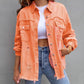 Women’s casual ripped shirt jacket in orange with distressed details and button front closure