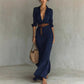 Elegant navy blue irregular long dress with belt and button lapel, long sleeves, perfect for office and daily wear
