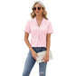 Woman wearing pink V-neck hollow design short-sleeve summer T-shirt with jeans and sunglasses
