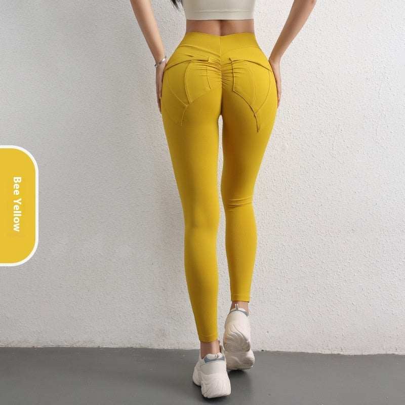 Women's high waist hip lift yoga pants in bee yellow with pockets, designed for sports fitness and comfort