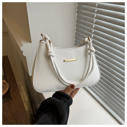 Women's high-end hand-held small white square bag with gold accents and single shoulder strap