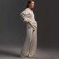 Woman wearing fall winter two-piece loose solid color collar sweater set in milky white cotton
