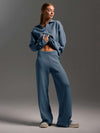Woman wearing cloudy blue loose two-piece fall winter set with collar sweater and wide-leg pants