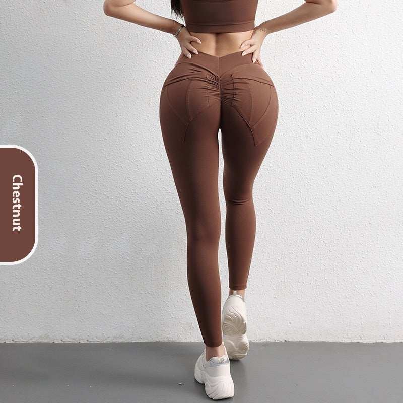 Women's high waist hip lift yoga leggings in chestnut color with pockets for sports and fitness.