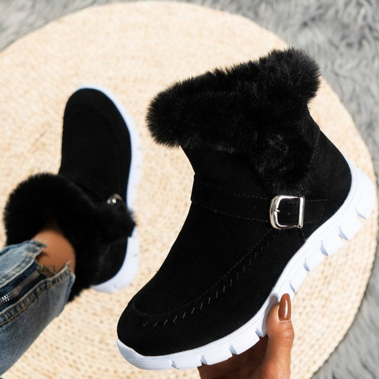 Black winter snow boots with plush fur lining and buckle design, flat white rubber sole