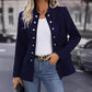 Woman wearing dark blue winter fashion double breasted stand collar cardigan jacket with silver buttons and long sleeves