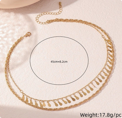 Gold multi-layer braided chain necklace with disc droplets and waterdrop-shaped tassels