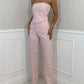 woman wearing pink shiny vest diamond trousers suit with strapless top and high-waisted pants