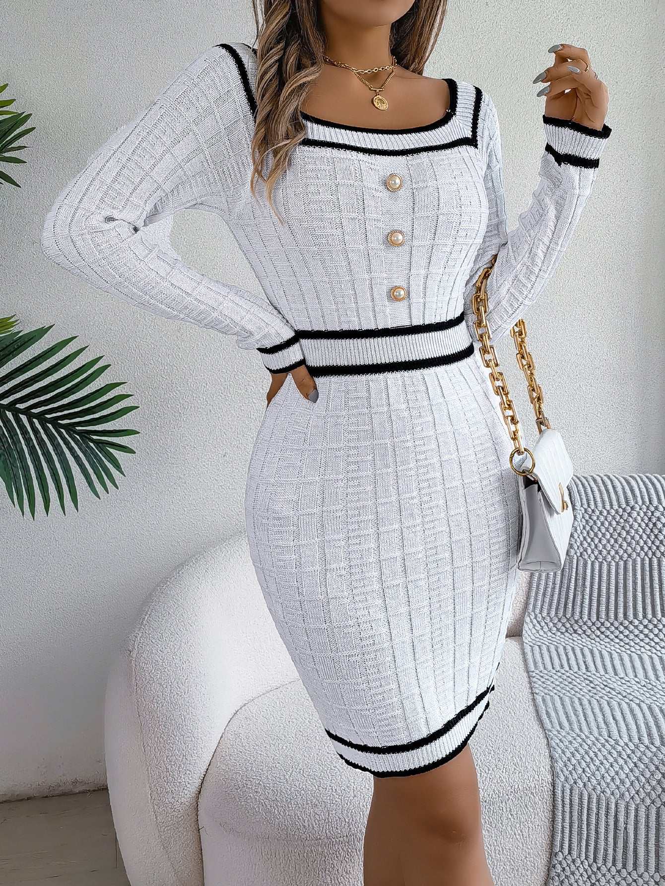 Women's long-sleeved white sweater hip skirt dress with black trim and buttons in knit fabric