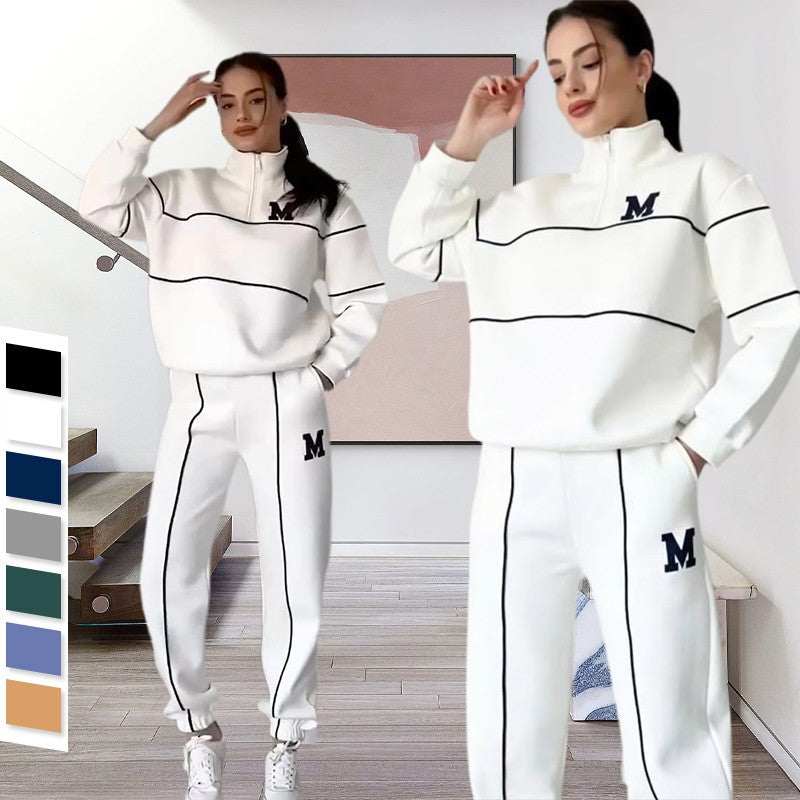 Women 2 piece white lounge sweatsuit with black stripes and letter M logo
