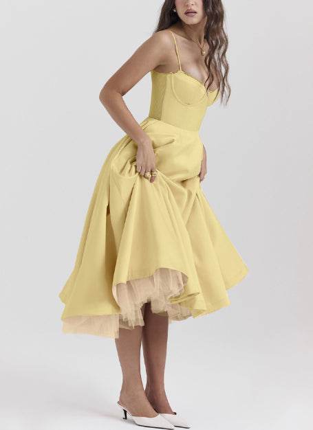 Woman wearing yellow women's V-neck brace sleeveless long puffy dress with high waist and polyester fabric