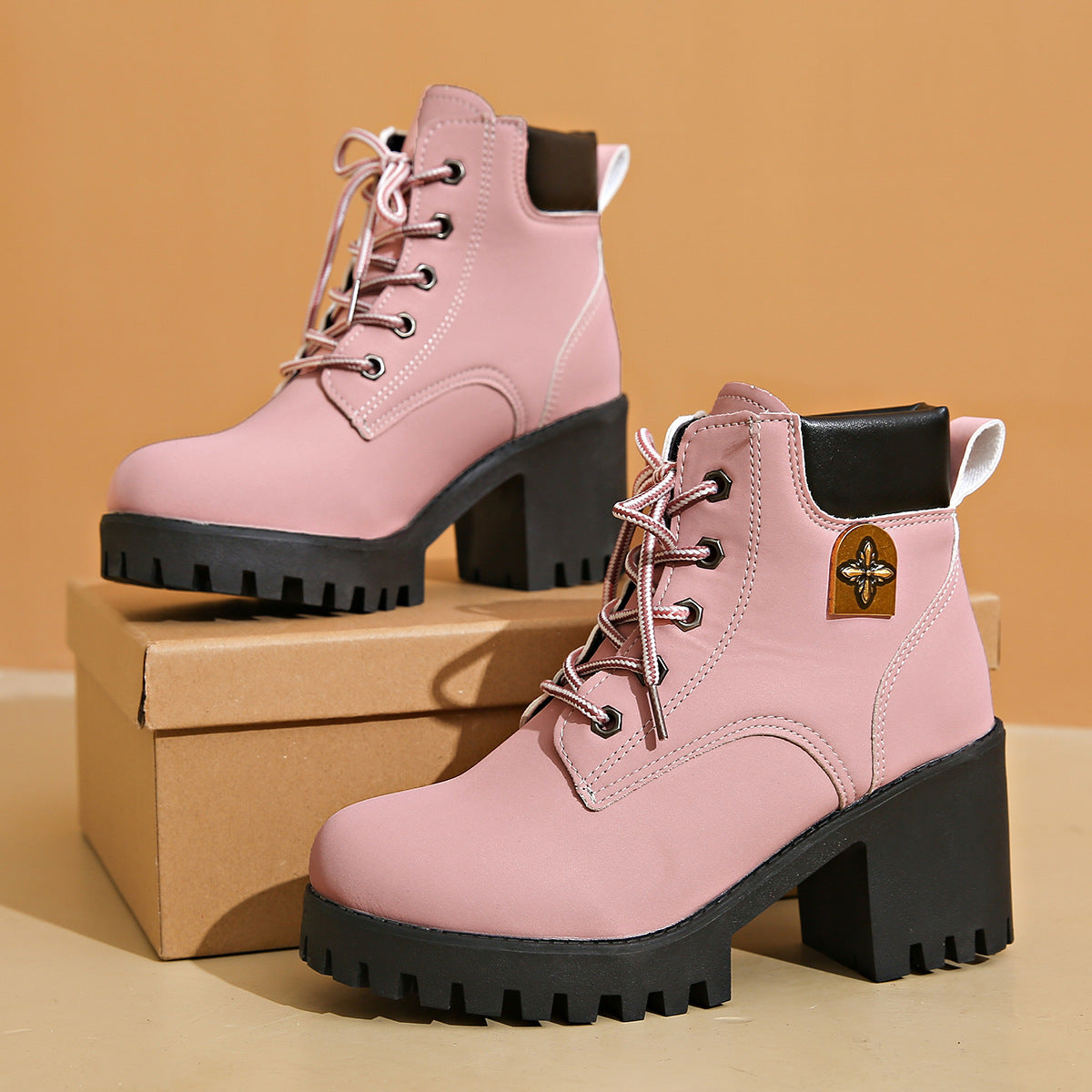 Plus size pink chunky heel Martin boots with thick black platform and front lace-up design