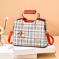 Large capacity fashion women's handbag with plaid design and red handles, medium-soft PU material, and sandwich zipper pockets.