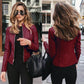 Woman wearing wine red autumn winter fashion leather PU jacket with zipper front and fitted design, urban casual style.