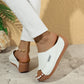 Women's white summer wedge slides with fish mouth design and thick brown sole on concrete floor
