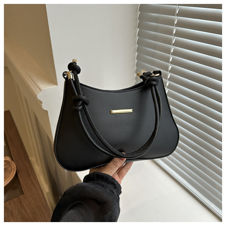 Women's high-end hand-held black small square PU handbag with gold accents and shoulder strap