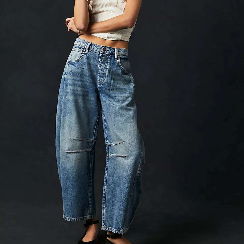 Women wearing high stretch mid-rise wide leg loose fit denim jeans in blue stone wash