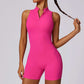 Women’s pink sleeveless fitness yoga jumpsuit with front zipper and backless shorts design
